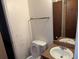 Small bathroom with toilet and sink at 4414 Blackbirch Ln, Decatur, GA 30034