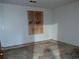 Simple bedroom with a plywood covering where a window should be at 4414 Blackbirch Ln, Decatur, GA 30034