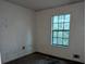 Small bedroom with a window and damaged walls at 4414 Blackbirch Ln, Decatur, GA 30034
