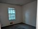 Simple bedroom with a window and carpeted floor at 4414 Blackbirch Ln, Decatur, GA 30034