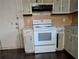 White stove and cabinets in the kitchen at 4414 Blackbirch Ln, Decatur, GA 30034