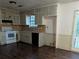 Full view of kitchen with white appliances at 4414 Blackbirch Ln, Decatur, GA 30034