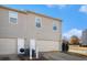 Rear view of townhome with two-car garage and exterior access at 5473 Festival Ave, Fairburn, GA 30213