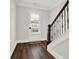 View of entryway with hardwood floors and staircase at 2128 Cosette Ln, Kennesaw, GA 30152