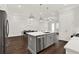 Modern kitchen with gray island and stainless steel appliances at 2128 Cosette Ln, Kennesaw, GA 30152