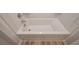 Clean and bright bathtub in a well-lit bathroom at 5981 Northbend Ct, Douglasville, GA 30134