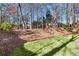 Landscaped backyard with stone steps and lush grass at 893 Brookgreen Pl, Lawrenceville, GA 30043