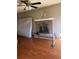 Living room with brick fireplace and hardwood floors at 1056 Brandon Hill Way, Jonesboro, GA 30238