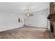 Spacious living room featuring hardwood floors, a stone fireplace, and access to a sunroom at 3193 Deshong Dr, Stone Mountain, GA 30087