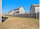 Fenced backyard with a grassy lawn and a concrete patio at 2291 Elise Way, Hampton, GA 30228