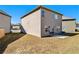 View of the house's back elevation and backyard at 2291 Elise Way, Hampton, GA 30228