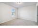 Simple bedroom with carpet flooring and window at 2291 Elise Way, Hampton, GA 30228
