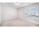 Bright bedroom with carpet flooring and window at 2291 Elise Way, Hampton, GA 30228