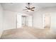 Bright bedroom with carpet flooring and access to bathroom at 2291 Elise Way, Hampton, GA 30228