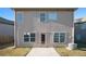 Rear view of the house showing a patio and AC unit at 2291 Elise Way, Hampton, GA 30228