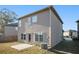 Rear view of house, showing patio, AC unit, and yard at 2291 Elise Way, Hampton, GA 30228