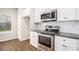 Modern kitchen with stainless steel appliances and granite countertops at 2291 Elise Way, Hampton, GA 30228