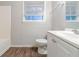 Bathroom with white vanity, toilet and tub at 4796 Fairforest Dr, Stone Mountain, GA 30088