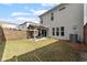 Private backyard with a covered patio and spacious grassy area at 510 Cooper Ln, Woodstock, GA 30189