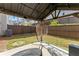 Covered patio with hanging chair and fire pit at 510 Cooper Ln, Woodstock, GA 30189