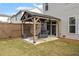 Covered patio with pergola, hanging chair, and grill at 510 Cooper Ln, Woodstock, GA 30189