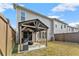 Private backyard with a covered patio and spacious grassy area at 510 Cooper Ln, Woodstock, GA 30189