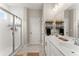 Double vanity bathroom with white cabinets and a large mirror at 510 Cooper Ln, Woodstock, GA 30189
