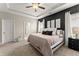 Spacious primary bedroom with plush carpeting and ample natural light at 510 Cooper Ln, Woodstock, GA 30189