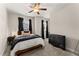 Comfortable bedroom with a ceiling fan and neutral decor at 510 Cooper Ln, Woodstock, GA 30189