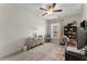 Bright bedroom with ceiling fan, wall decor and a home office setup at 510 Cooper Ln, Woodstock, GA 30189