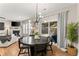 Bright dining area with round table, chandelier, and view to living room at 510 Cooper Ln, Woodstock, GA 30189