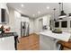 Modern kitchen with white cabinets, stainless steel appliances, and an island at 510 Cooper Ln, Woodstock, GA 30189