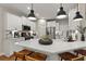 Modern kitchen featuring white cabinets, quartz countertops and island at 510 Cooper Ln, Woodstock, GA 30189
