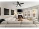 Bright living room with a fireplace and large sectional sofa at 510 Cooper Ln, Woodstock, GA 30189