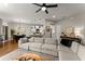 Open concept living area with sectional sofa and kitchen view at 510 Cooper Ln, Woodstock, GA 30189
