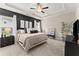 Large main bedroom with a king-size bed and dark accent wall at 510 Cooper Ln, Woodstock, GA 30189