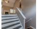 Gray and white painted staircase with wooden treads at 6781 Oakleigh Ct, Rex, GA 30273