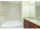 Bathroom with granite countertop, large vanity, and soaking tub at 855 Peachtree Ne St # 2807, Atlanta, GA 30308