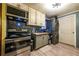 Basement kitchen with stainless steel appliances and wood cabinets at 3182 Latona Sw Dr, Atlanta, GA 30354