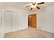 Spacious bedroom with ceiling fan, closet, and carpeted flooring at 2052 Brannen Se Rd, Atlanta, GA 30316