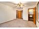 Empty bedroom with a ceiling fan, closet, and attached bathroom at 2052 Brannen Se Rd, Atlanta, GA 30316