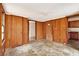 Wood-paneled bonus room with multiple doorways and access to the kitchen at 2052 Brannen Se Rd, Atlanta, GA 30316