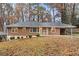 Brick ranch house with a landscaped yard at 2052 Brannen Se Rd, Atlanta, GA 30316