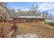 Brick home with large backyard and trees on a sloped lot at 2052 Brannen Se Rd, Atlanta, GA 30316