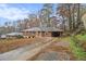 Ranch house with a driveway and mature trees at 2052 Brannen Se Rd, Atlanta, GA 30316