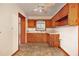 Small kitchen with wood cabinets and flooring at 2052 Brannen Se Rd, Atlanta, GA 30316