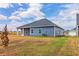 View of the back of the house, showcasing a spacious backyard at 231 Orwell Dr, Social Circle, GA 30025