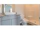 Clean bathroom with granite vanity, modern toilet and shower at 231 Orwell Dr, Social Circle, GA 30025