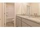 Modern bathroom with granite countertop, double vanity, and bathtub at 231 Orwell Dr, Social Circle, GA 30025