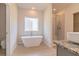 Bathroom with free-standing tub and walk-in shower at 231 Orwell Dr, Social Circle, GA 30025
